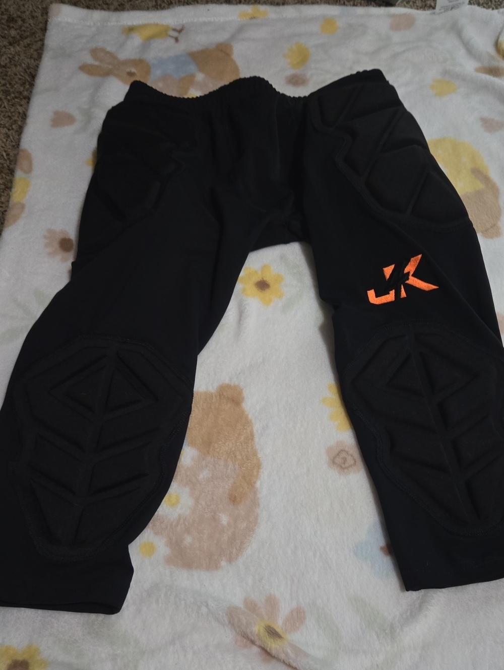 J4K Soccer Goalie Padded Black Athletic Bottoms with Orange Logo
